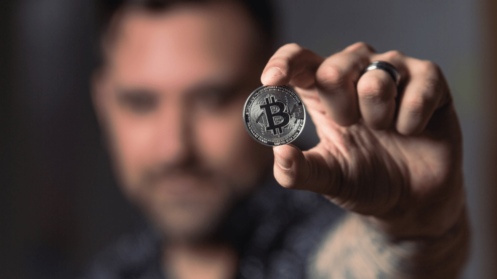 a person holding a crypto