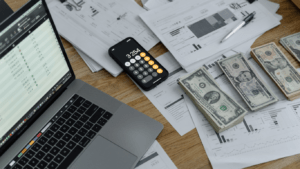 image of a laptop with money