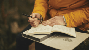 a person writing in a book