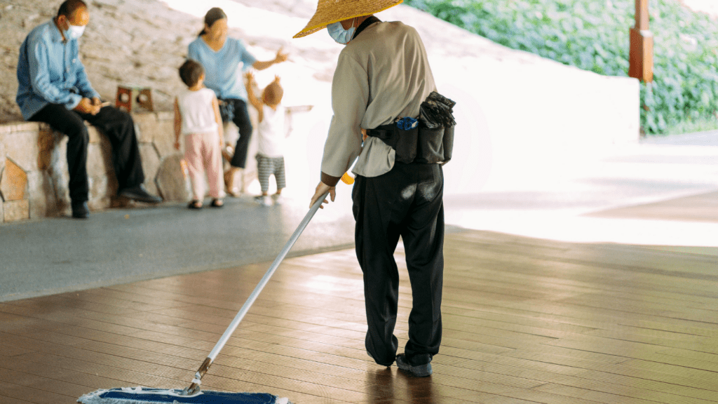 a person holding a mop