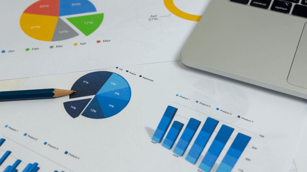 calculator, pen and glasses on financial documents