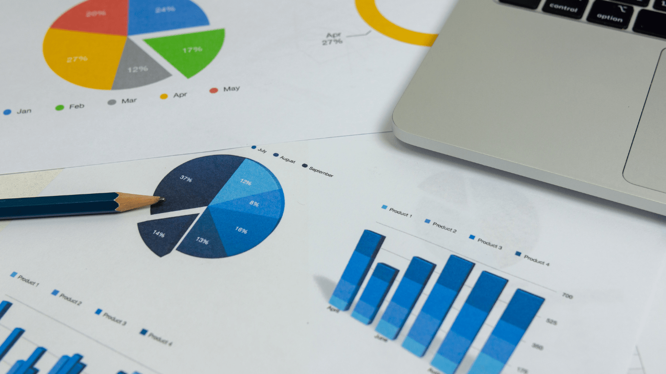 calculator, pen and glasses on financial documents