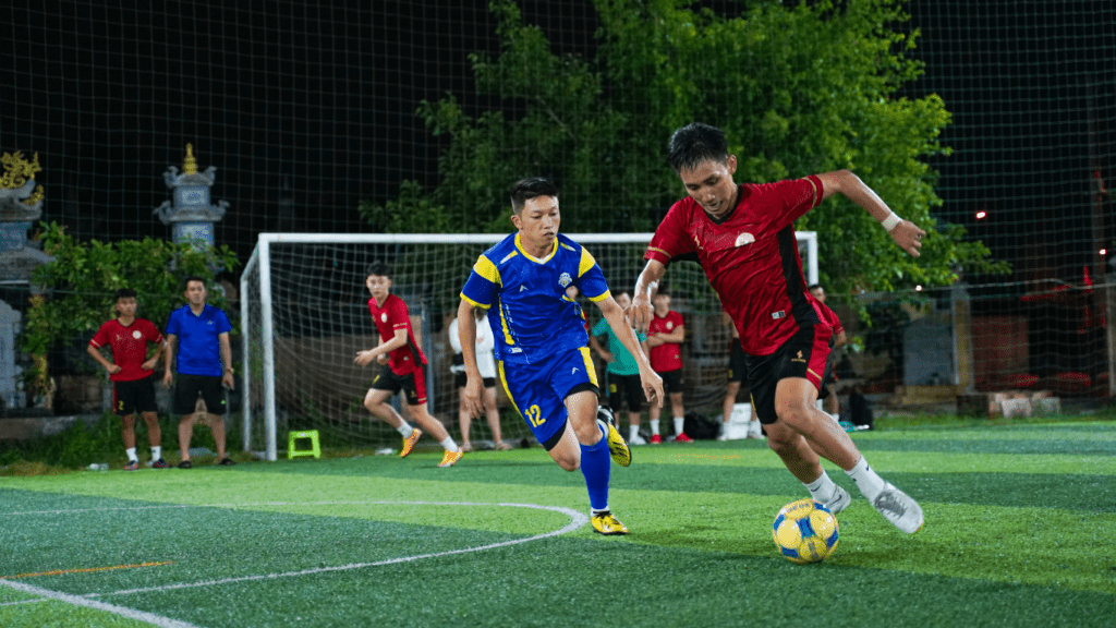 two soccer players in action on the field