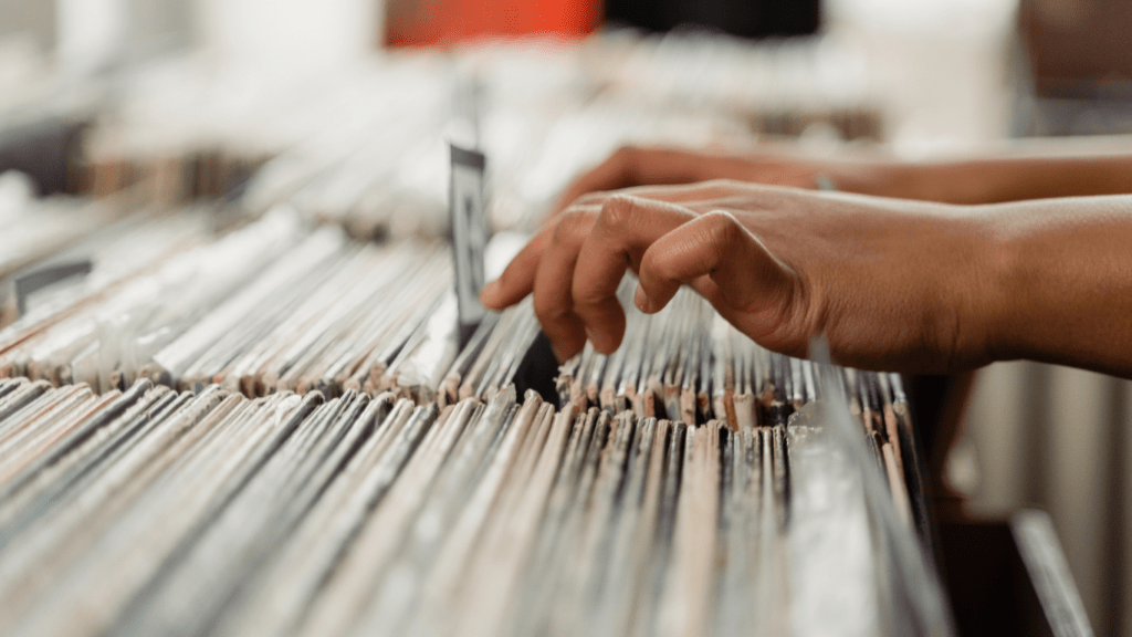 a row of vinyl records in a record store