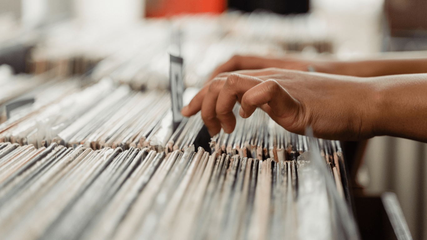 a row of vinyl records in a record store