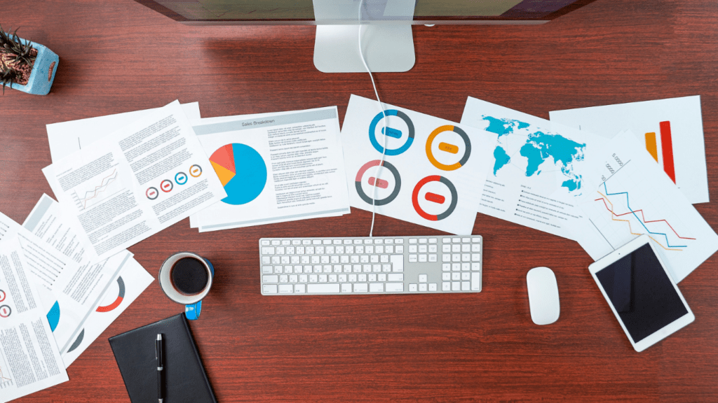 image of a computer table with a piece of paper