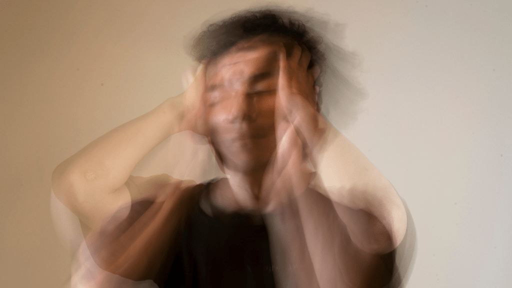 person covering their face