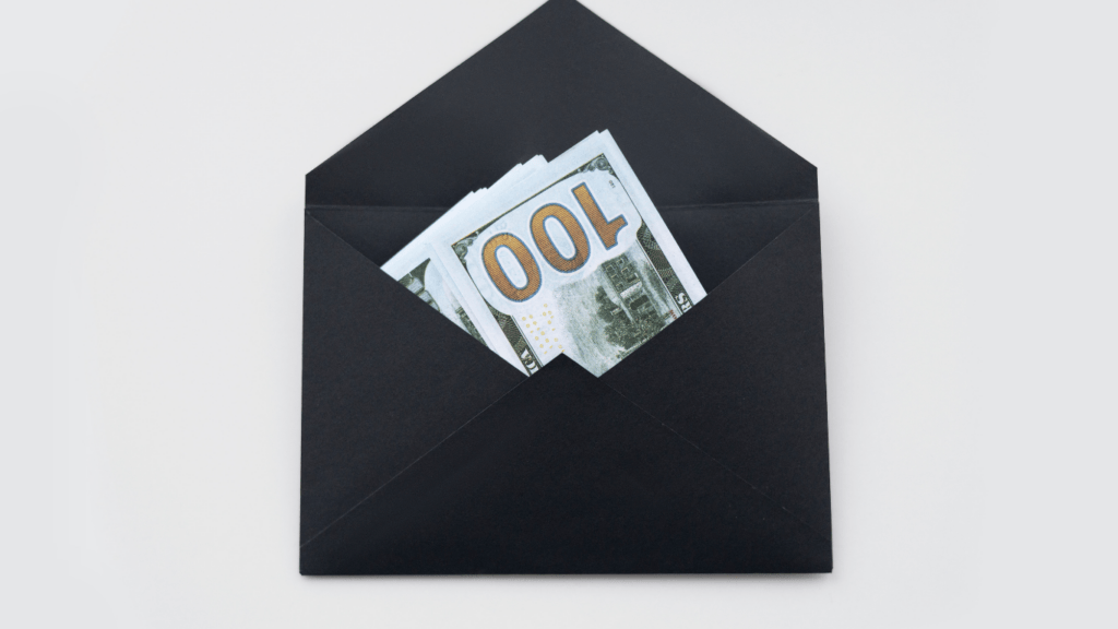 a black envelope with 100 dollars in it