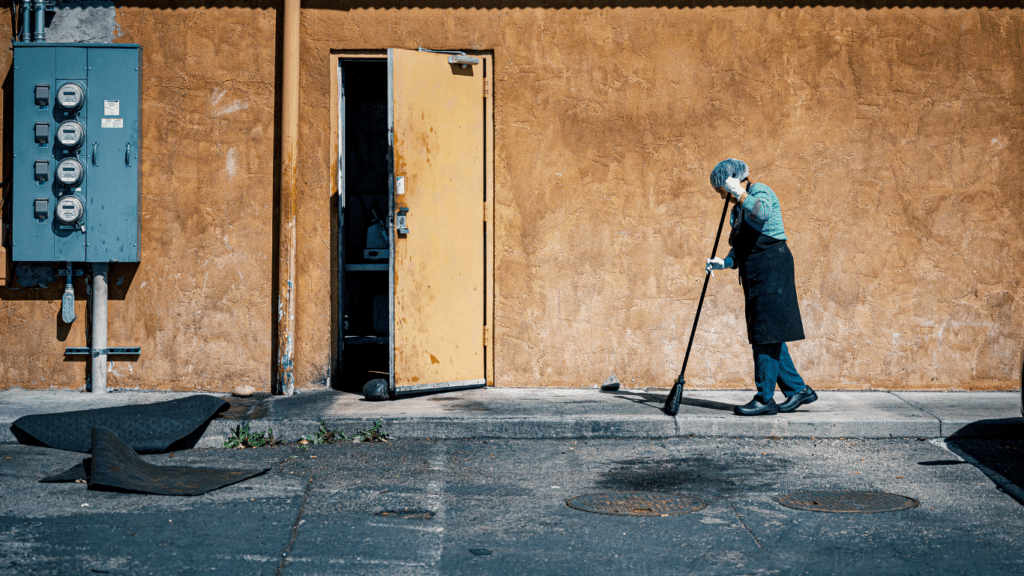 a person holding a mop