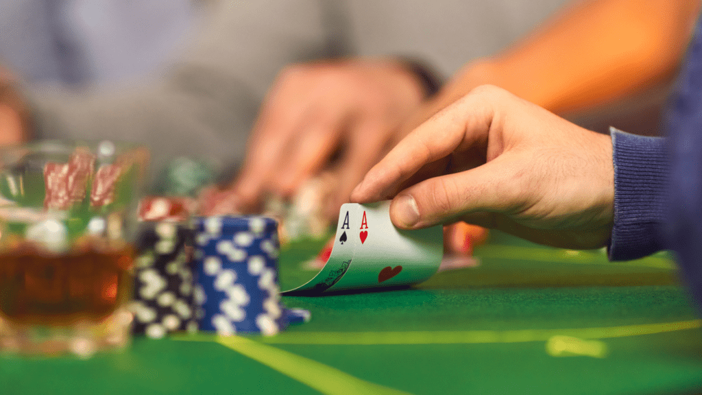 a person holding a pair of card