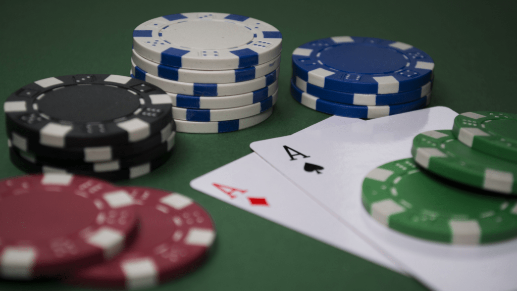 a playing card and a casino chips