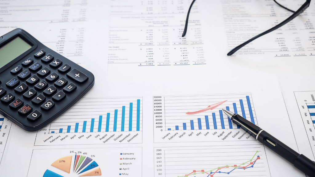 calculator and a pen on financial documents