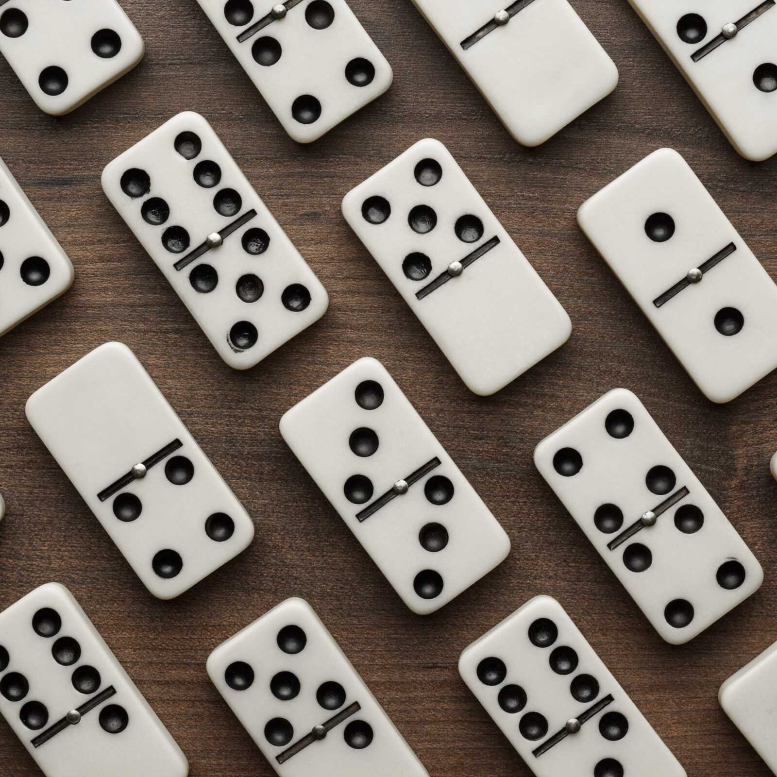 domino pieces on the wooden table background