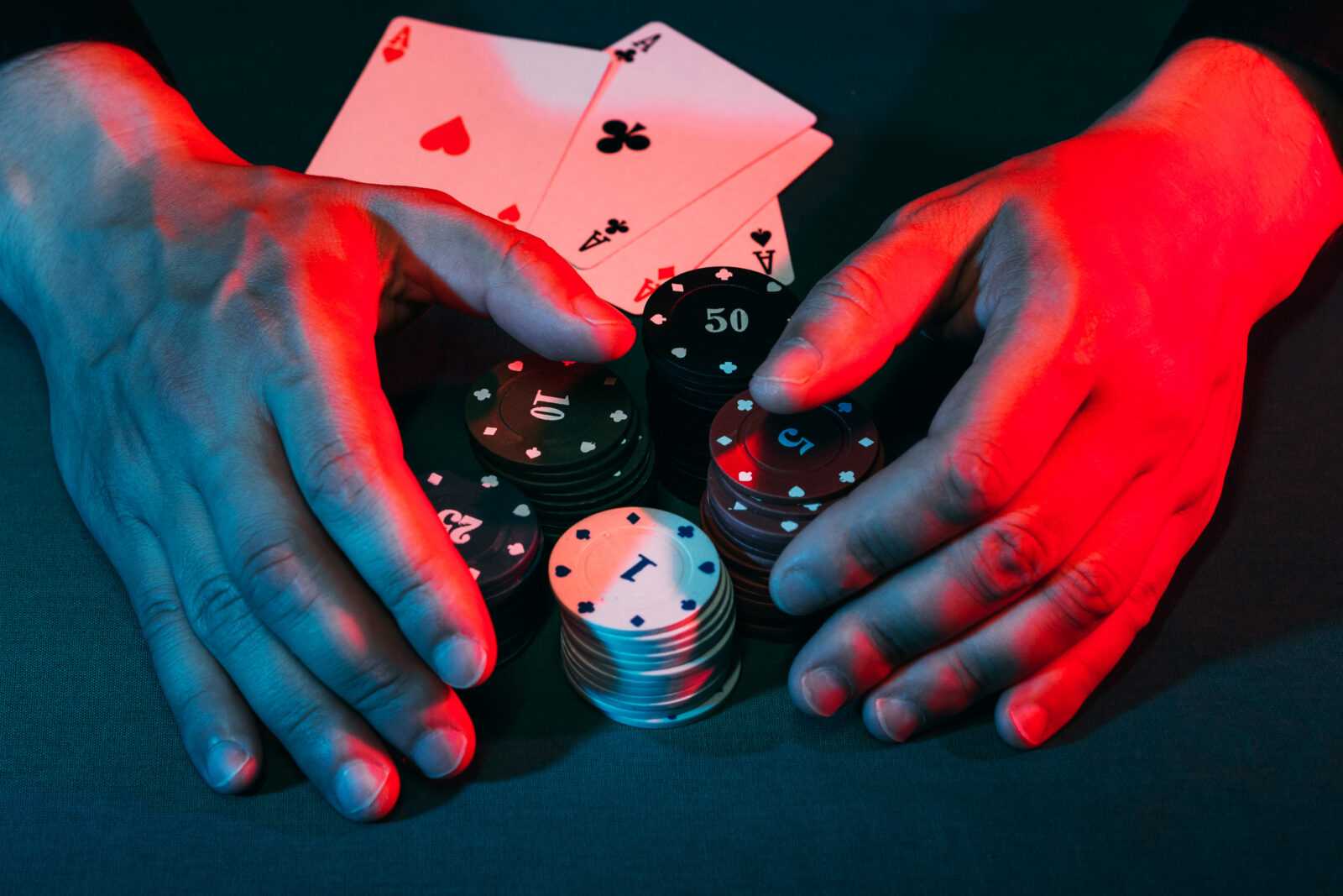men's hands take away the playing chips placed on the bet. victory