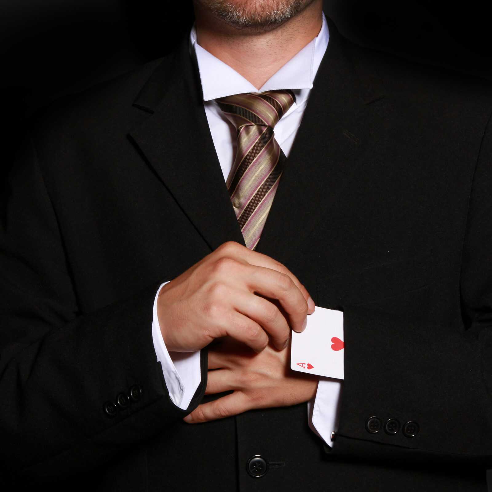 Person cheating while playing cards