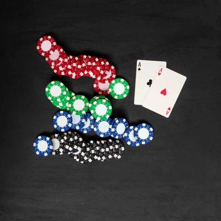 Two cards aces and chips, poker game